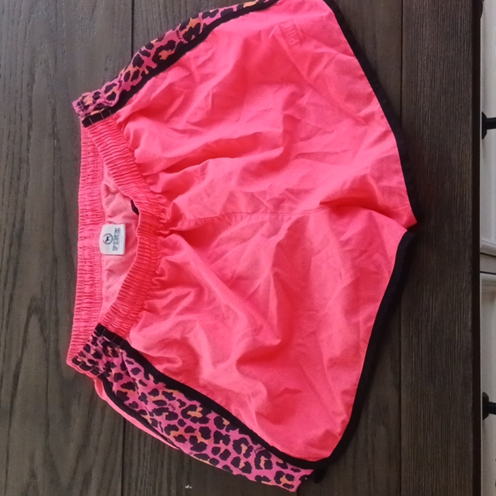 Pink coral gym shorts with leopard print detail